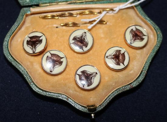 An early 20th century cased six piece gold mounted and enamel dress stud set,
